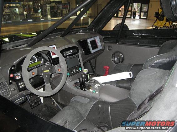 Custom off-road interior with racing seats, Momo steering wheel, and GPS screen