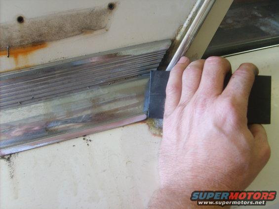 First I spray the top of the panel with WD40 until it is running out the bottom of the trim. Then I use a delrin block and hammer to tap the sail panel back.