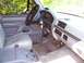 1994 Ford Bronco - The interior of a truck is shown, the driver's seat, dashboard, and steering wheel.