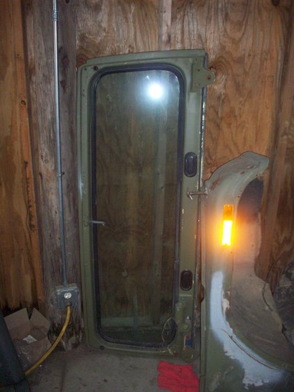 Green Jeep CJ door with glass and fender section with amber light