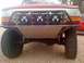 1989 Ford Bronco - Front view of a 1989 Ford Bronco modified with a custom bumper and off-road lights.