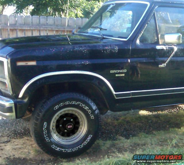 1986 Ford Bronco, black exterior, front fender and door visible