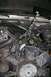1992 Ford C-350 (Centurion Conversions) - The engine bay of a 1992 Ford C-350 (Centurion Conversions) shows a chain hoist rigged to the hood for engine work.