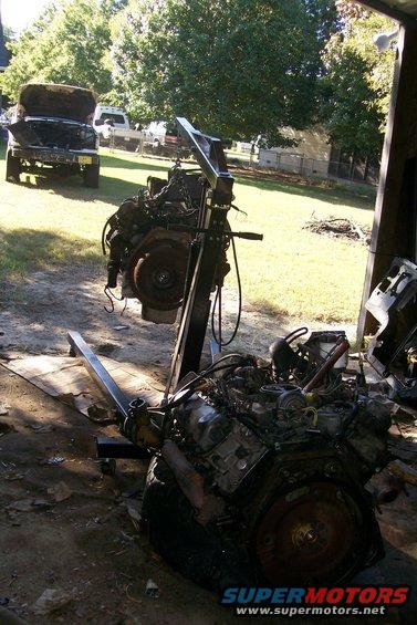 Old engine, new engine, and the truck it's going into.