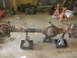 1991 Ford F-150 - Rear axle assembly supported by jack stands in a garage setting.