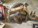 1991 Ford F-150 - Front axle assembly with brake rotor and suspension components, likely from a truck.