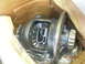 1991 Ford F-150 - Close-up of a differential assembly with visible gears and a bearing, packaged in a cardboard box.