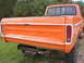 1975 Ford F-250 - Rear view of an orange 1975 Ford F-250 pickup truck with a trailer hitch installed.