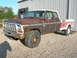 1975 Ford F-250 - This 1975 Ford F-250 crew cab pickup shows significant rust and wear.