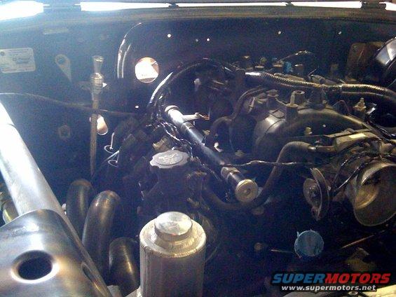 Engine bay with exhaust headers and intake manifold