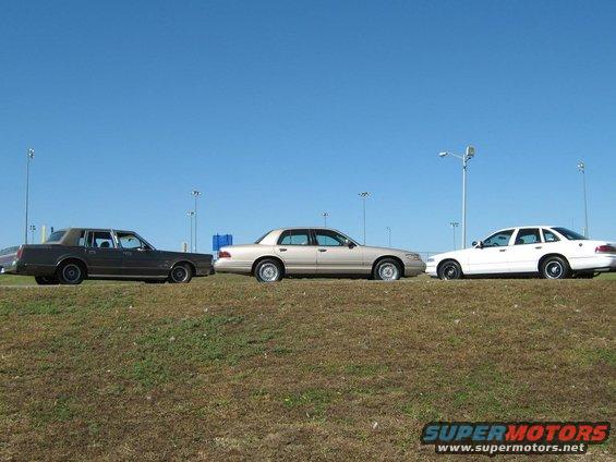 2000 Mercury Grand Marquis parked next to two other sedans