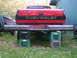 1984 Chevrolet Blazer - Rear view of a red Chevrolet pickup truck with a custom bumper, elevated by milk crates.
