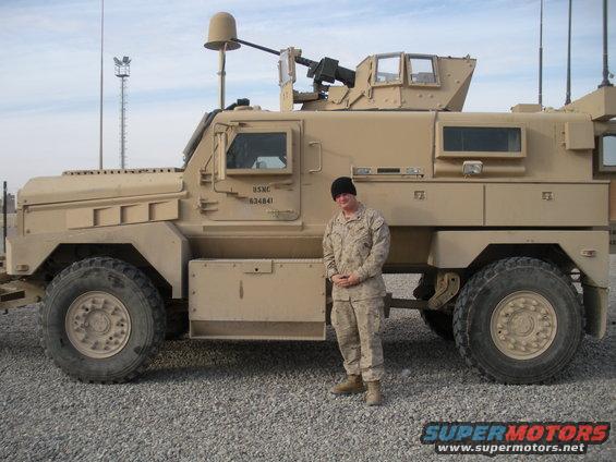 USMC 634841 military truck with a person standing next to it