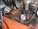 1971 Chevrolet Camaro - This image shows a close-up view of various engine parts, including a carburetor and distributor, with visible hoses and wiring.