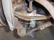 1971 Chevrolet Camaro - Close-up view of corroded vehicle suspension components, with a jack visible underneath.