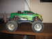 1992 Ford Ranger - This remote control monster truck features a green body with flame graphics and oversized wheels.