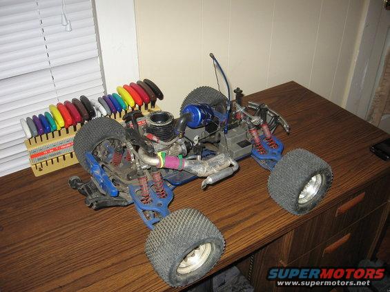 Blue remote control monster truck with engine and colorful tools