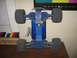 1992 Ford Ranger - The underside of a blue remote control car chassis is visible, with large tires and suspension components.