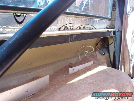 The w/s frame has to go forward & up slightly to fold down onto the hood, and so the roof has to be lifted.  That means accessing the bolts under the bedrails, which means I've had to remove most of the interior trim.