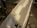 1995 Ford Taurus - White painted car frame section, likely undergoing restoration or repair.