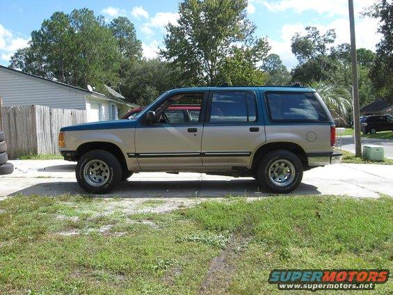 Side view of a 1992 Ford Explorer, tan and teal two-tone paint