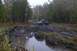 1988 Chevrolet Blazer - Truck stuck in mud on a wooded trail, likely off-roading.