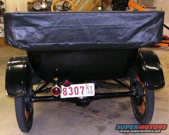 Rear view of a black 1915 Ford Model T with a Kentucky license plate reading 8307 KY 1915