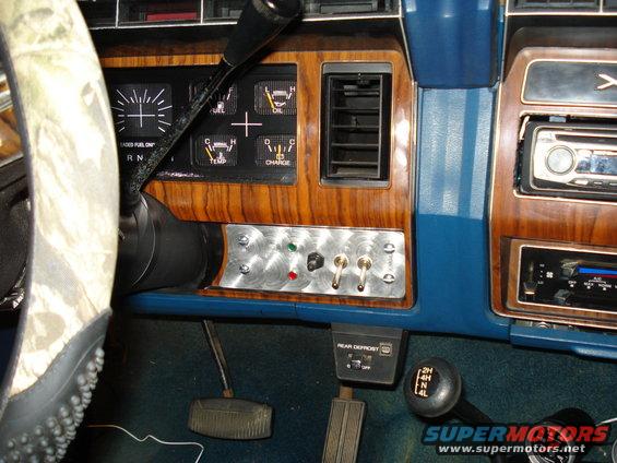 1984 Ford Bronco interior dash with aftermarket switches, gauges, and radio