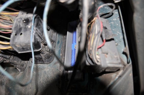 Engine computer wiring harness with blue connector and various colored wires