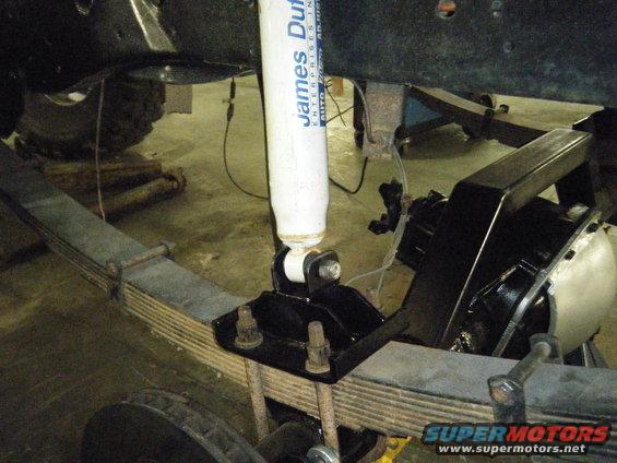 Rear suspension part with James Duff shock absorber and leaf springs