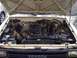 1989 Toyota Pickup/SR5 - Engine bay of a 1989 Toyota Pickup/SR5, showing the engine and surrounding components.
