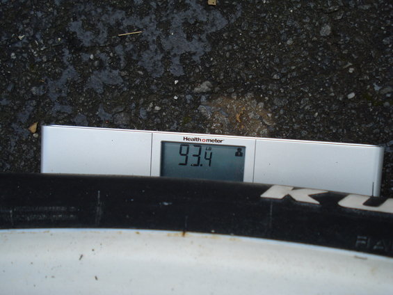Health o meter scale showing 93.4 lbs next to a tire