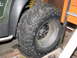 1971 International Travelall - The chunky tire and suspension of an ATV are visible in this close-up shot.