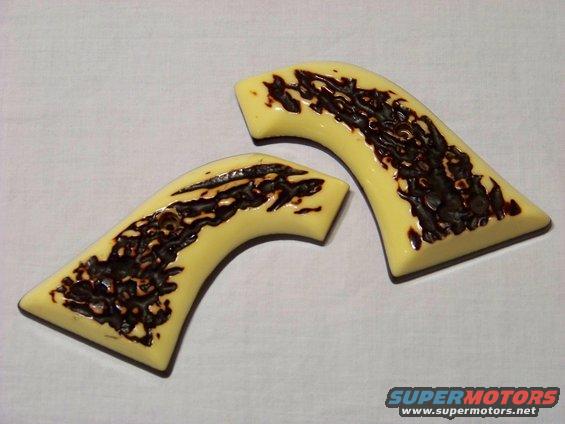 Pair of yellow gun grips with dark brown textured inserts