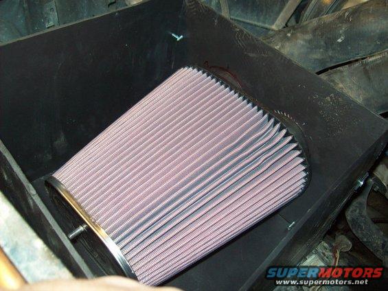 Close-up of a new engine air filter in its housing