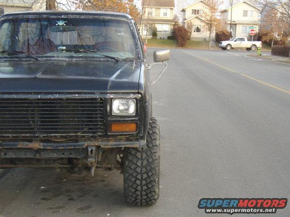 Black Ford Bronco with lifted suspension and off-road tires, front view
