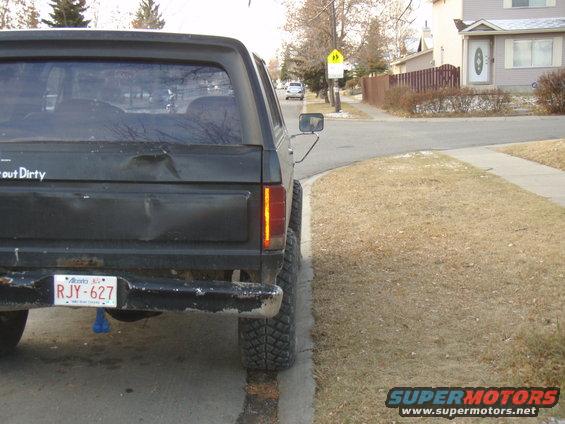 1985 Ford Bronco rear view, showing dented tailgate and Alberta license plate RJY-627