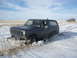1985 Ford Bronco - Ford Bronco stuck in a snowdrift on a clear day.