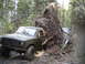 1985 Ford Bronco - Two off-road vehicles encounter a massive fallen tree on a muddy forest trail.