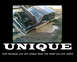 1985 Ford Bronco - A 1985 Ford Bronco is stuck in deep mud with its hood open.