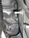 1979 Chevrolet C/K Pickup - Detail of an engine part, showing bolts and metallic surfaces.