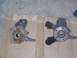 1999 Volkswagen Beetle - Two automotive wheel hubs are shown laid out on cardboard.