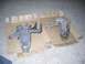 1999 Volkswagen Beetle - Two car suspension parts are shown laid out on cardboard on a carpeted floor.