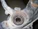 1999 Volkswagen Beetle - Close-up of a worn wheel bearing assembly, showing rust and damage.