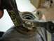 1999 Volkswagen Beetle - This is a close-up of a used automotive suspension part with visible markings.