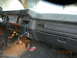 1991 Ford F-150 - Interior view of an older pickup truck's dashboard, showing signs of wear and aftermarket modifications.
