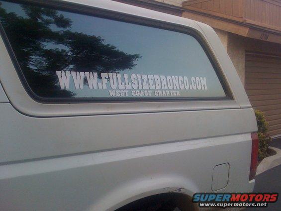 Side view of a white SUV with WWW.FULLSIZEBRONCO.COM WEST COAST CHAPTER sticker