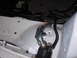 1995 Ford Taurus - Close-up of a starter relay and wiring harness in a white vehicle's engine bay.