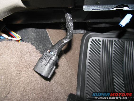Under the passenger side dash.