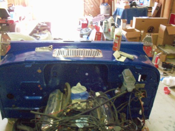 Blue 1978 Jeep CJ5 engine bay with exposed engine and wiring